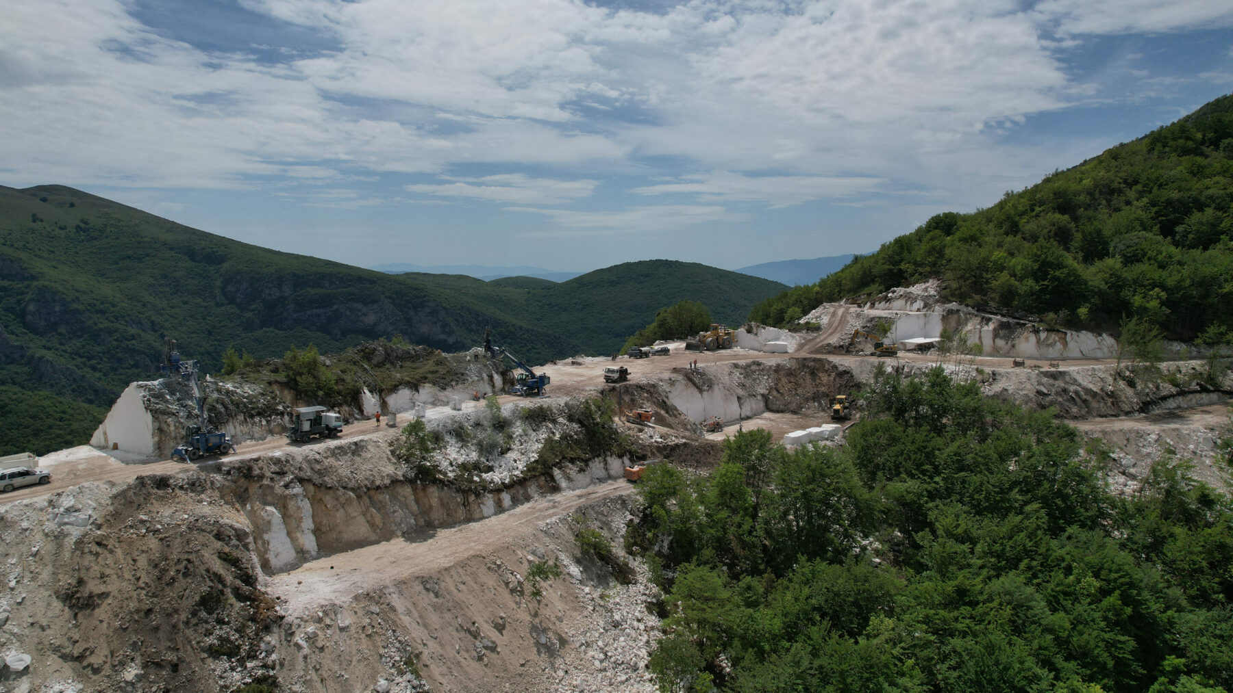 View of Sophia Quarry terraces with equipment and extraction zones, demonstrating quarry operational setup.